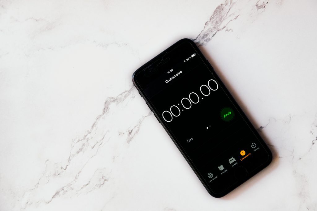 A phone on a counter with a timer app open. The timer is at 0. 