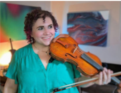 Stephanie Scheller holding a violin.